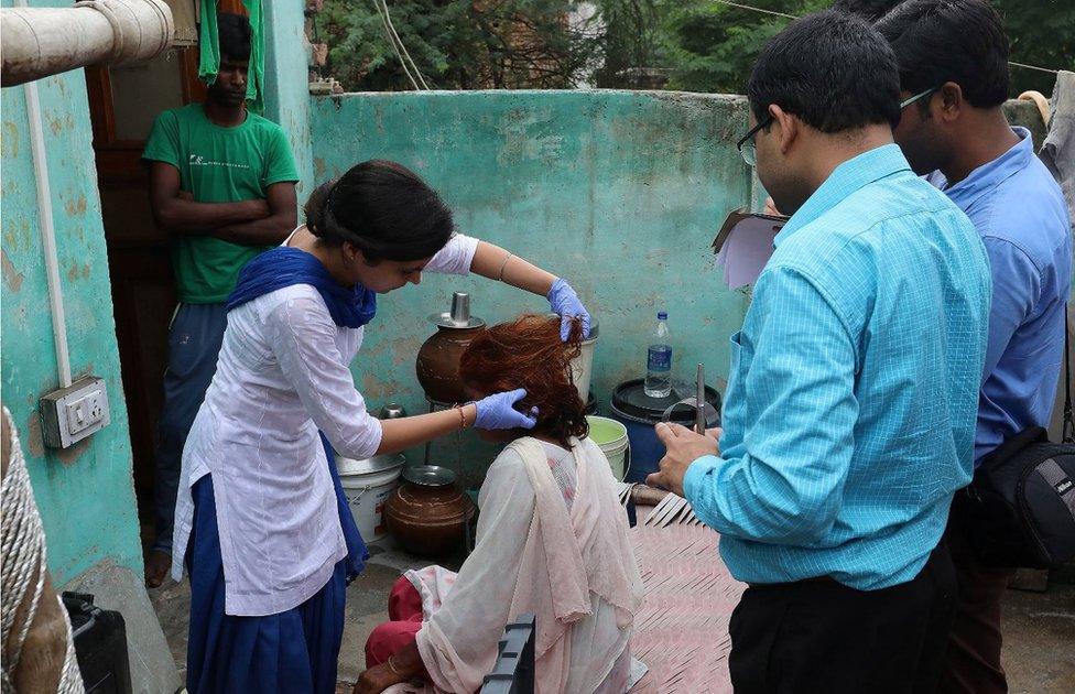 Indian Forensic experts examine Omvati"s hair, the 50 years old victim whose braids chopped off allegedly by unknown person in Kanganheri village, the outskirts of Delhi, India, 01 August 2017.