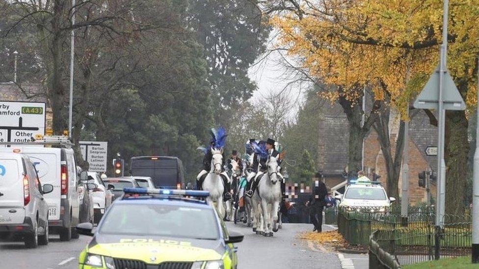 Procession with police car in front