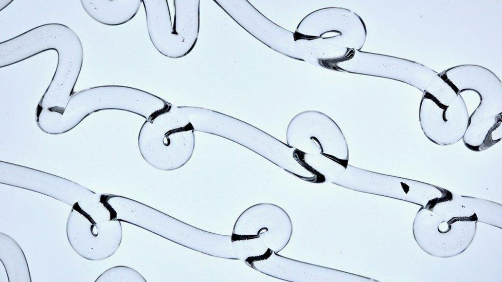 waves and loops of glass thread