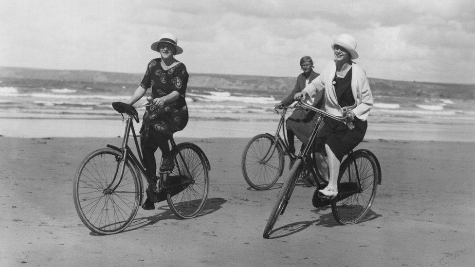 Group of women cycling on the beach in 1923