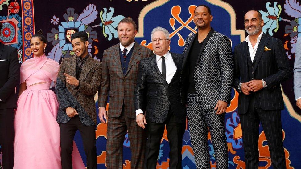 (L-r) Naomi Scott, Mena Massoud, Guy Ritchie, Alan Menken, Will Smith and Navid Negahban attend the world premiere of Aladdin in Los Angeles