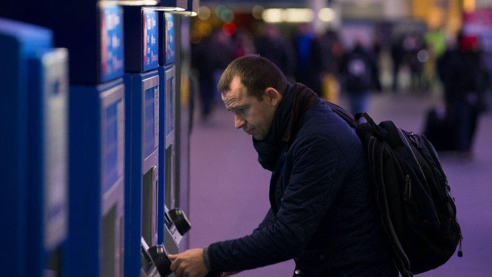 Man at ticket machine