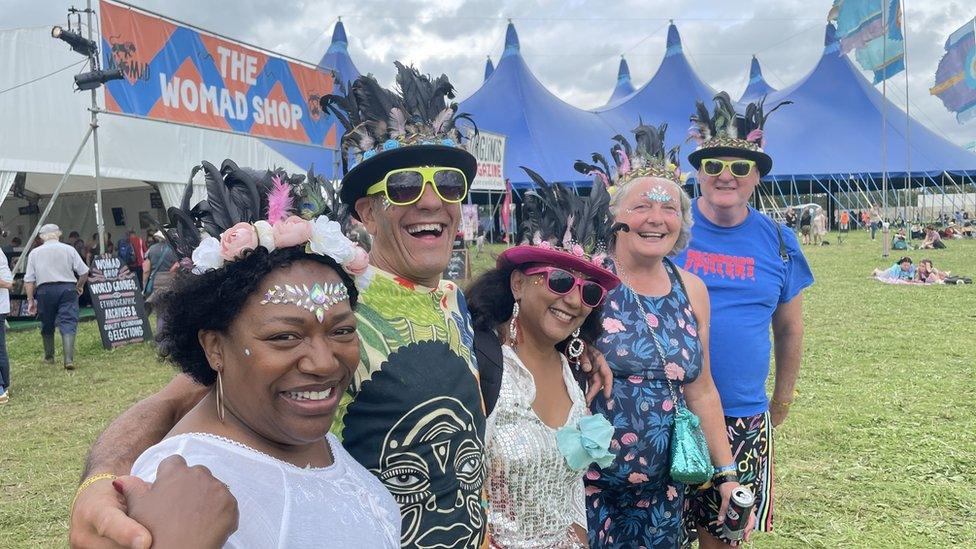 Revellers smiling for the camera at the festival