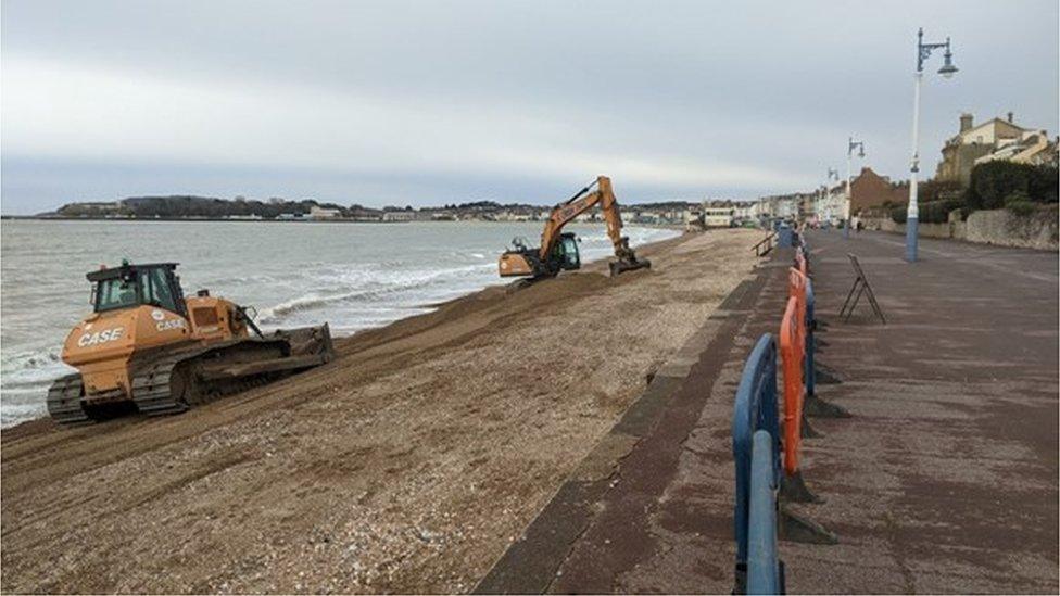 Diggers on Weymouth beach