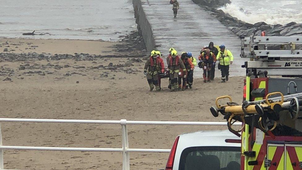 The fisherman was stretchered off the pier by emergency services after falling into the sea.