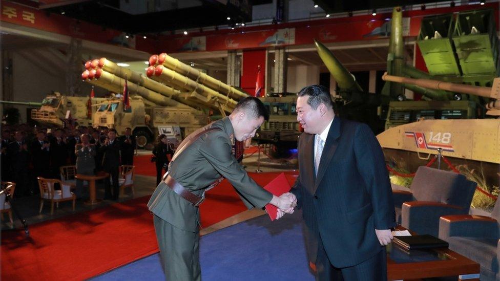 North Korea"s leader Kim Jong Un presents awards to military service personnel at the Defence Development Exhibition, in Pyongyang