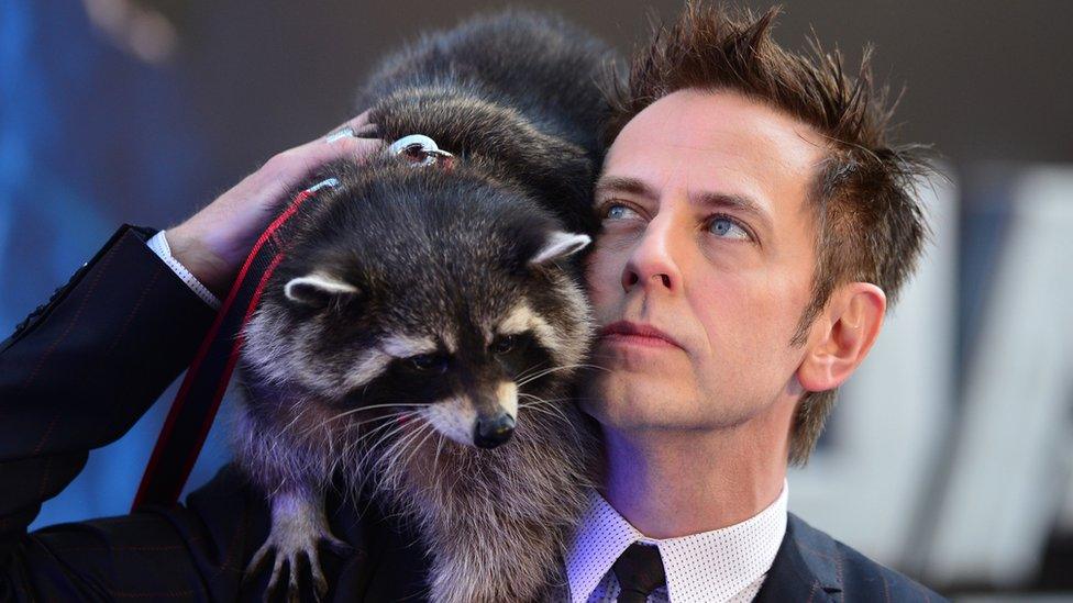 Oreo the raccoon and director James Gunn