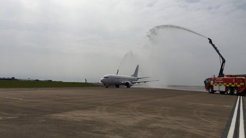 The Wales team plane took off under two fire engine water canons