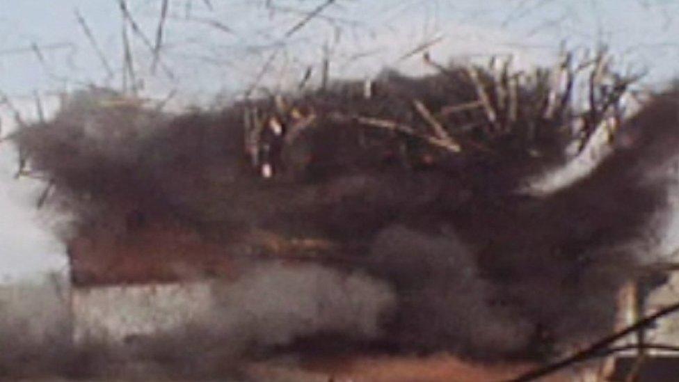 Archive video shows the Royal Marines struggling to blow up an engine shed at an old railway yard.