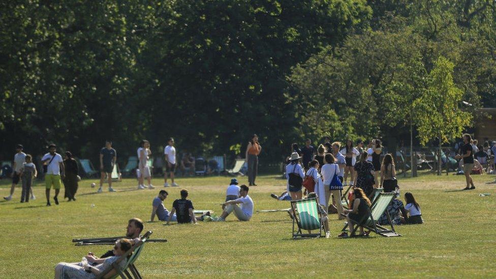 People relaxing in the hot weather