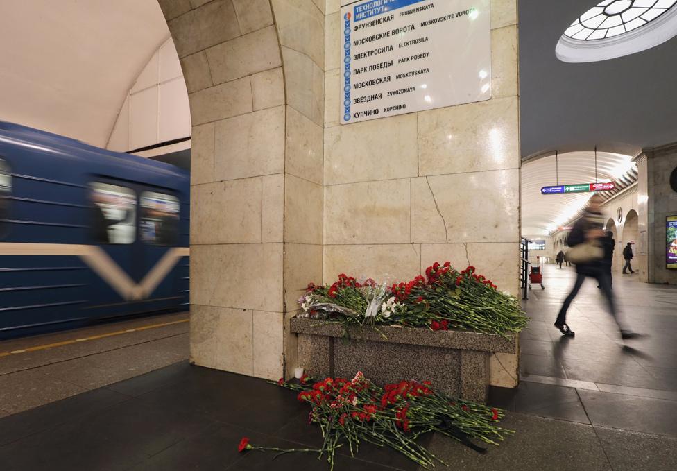 Flowers are seen at Tekhnologichesky Institut metro station in memory of the victims