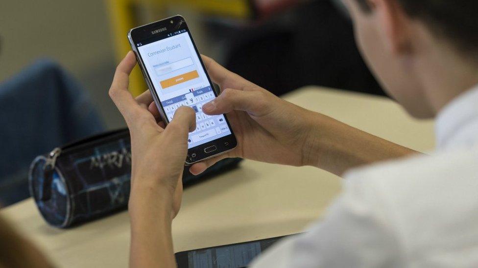 Pupil uses a smart phones at a school in Bischwiller, eastern France. September 26, 2017