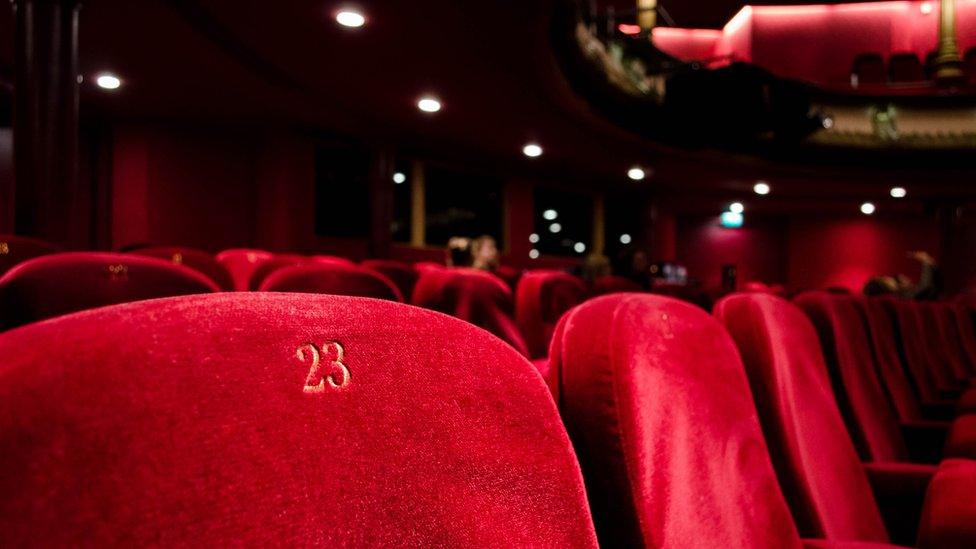 Empty theatre chairs