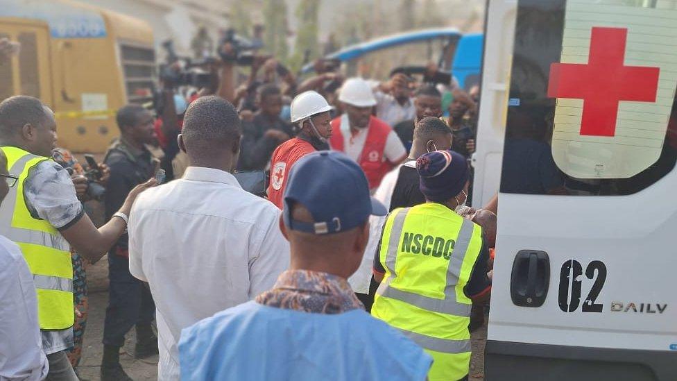 Rescue workers at the scene of the blast in Ibadan, Nigeria