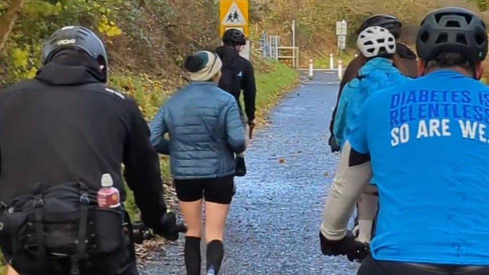 People cycling alongside Megan, pictured from behind