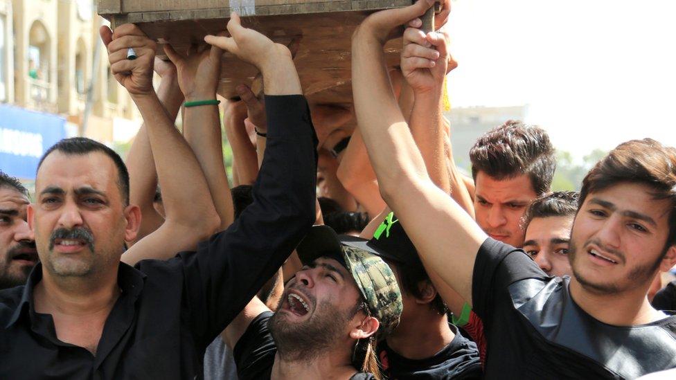 A bomb victim's funeral in Baghdad, 5 July