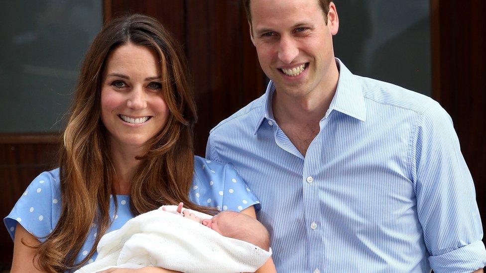 George with his parents outside hospital