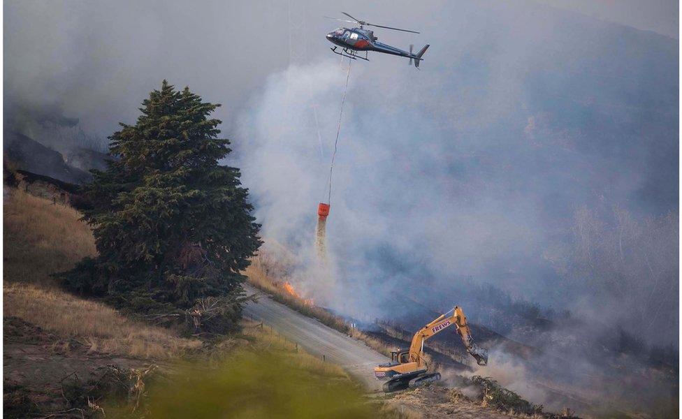 An undated handout photo made available by the Christchurch City Council (CCC) Newsline on 16 February 2017 shows emergency services fighting the Christchurch Port Hills fire on the outskirts of Christchurch, New Zealand's South Island.