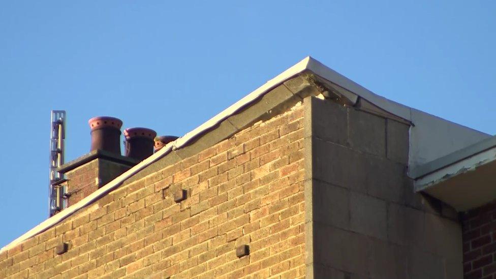 A close-up of the damaged roof