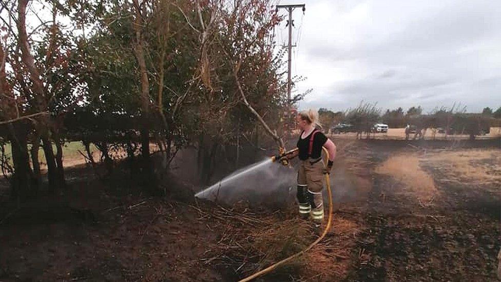 A firefighter at a Westoning field fire