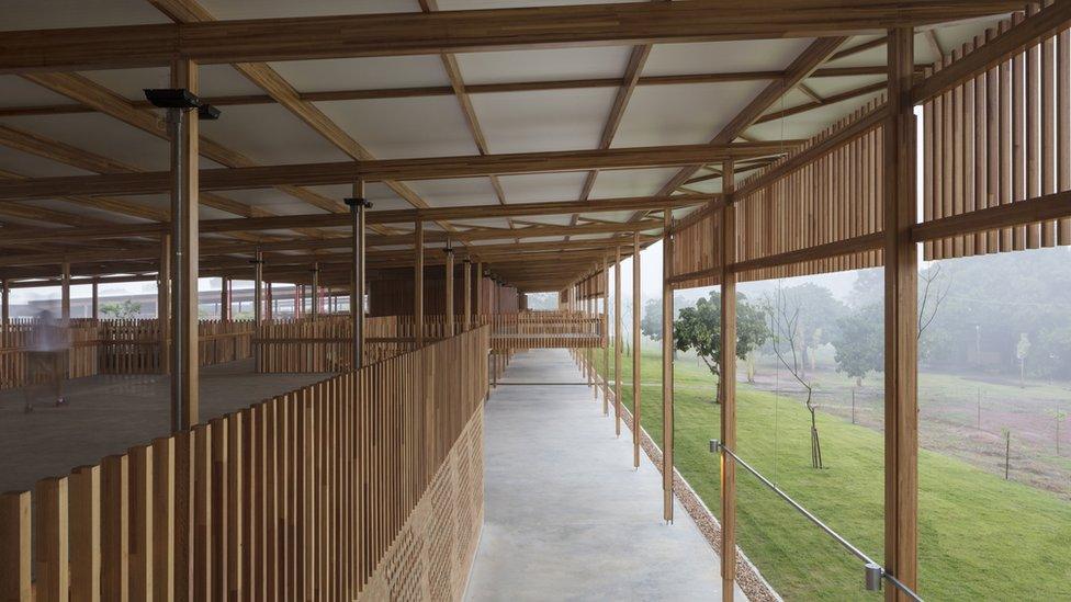 The upper-level walkways provide views of the courtyards and out into the natural landscape