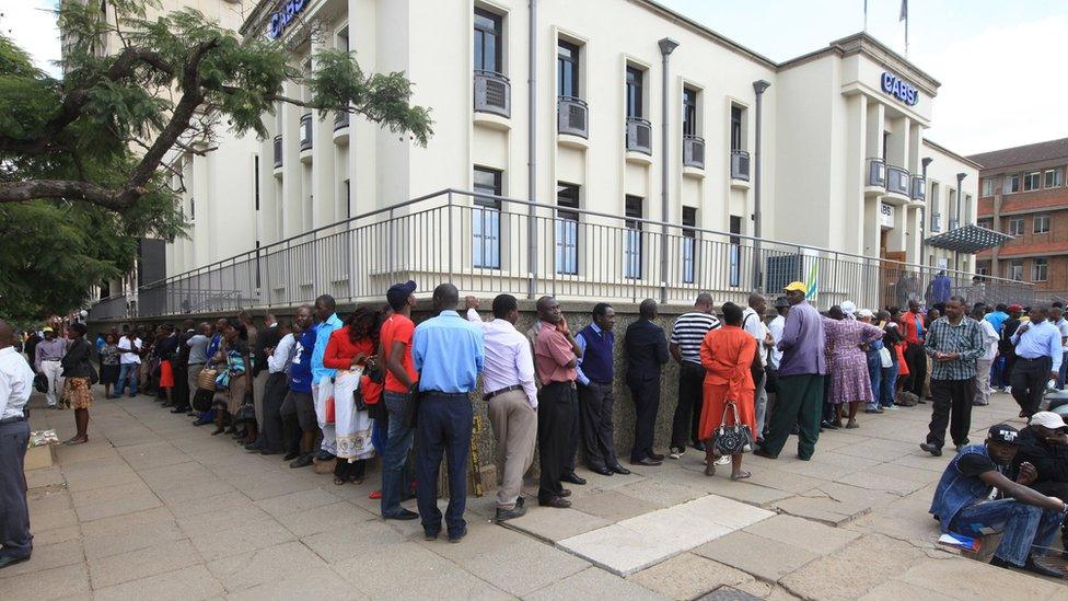 People queuing at a bank in the capital, Harare