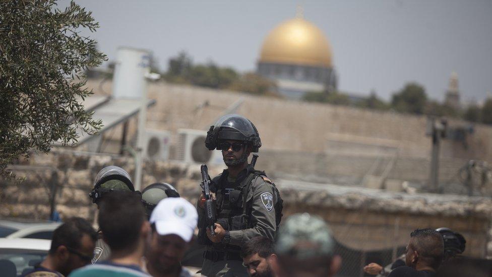 An Israeli border police officer is seen during Friday prayers