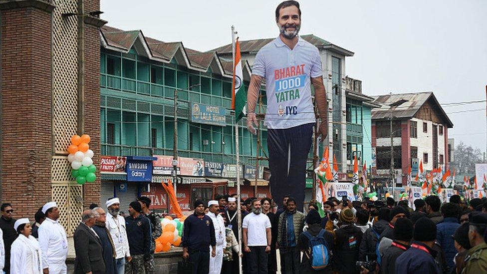 Congress leader Rahul Gandhi along with his sister Priyanka Gandhi and his supporters hoists the National Flag during 'Bharat Jodo Yatra at Lal Chowk in Srinagar