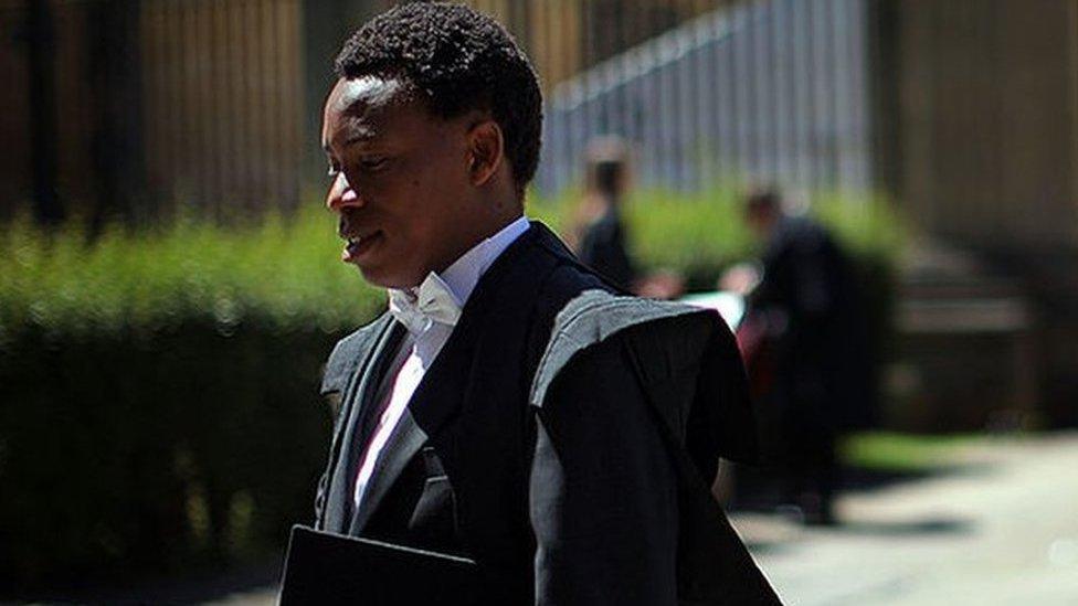 An Oxford University student arrive at the Exam Schools building