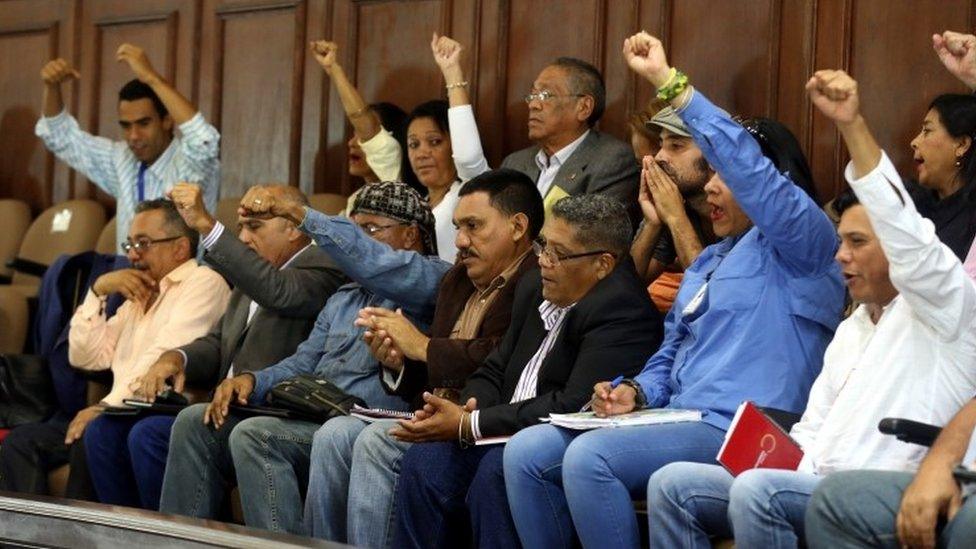 Members of Venezuela's constituent assembly raise their fists