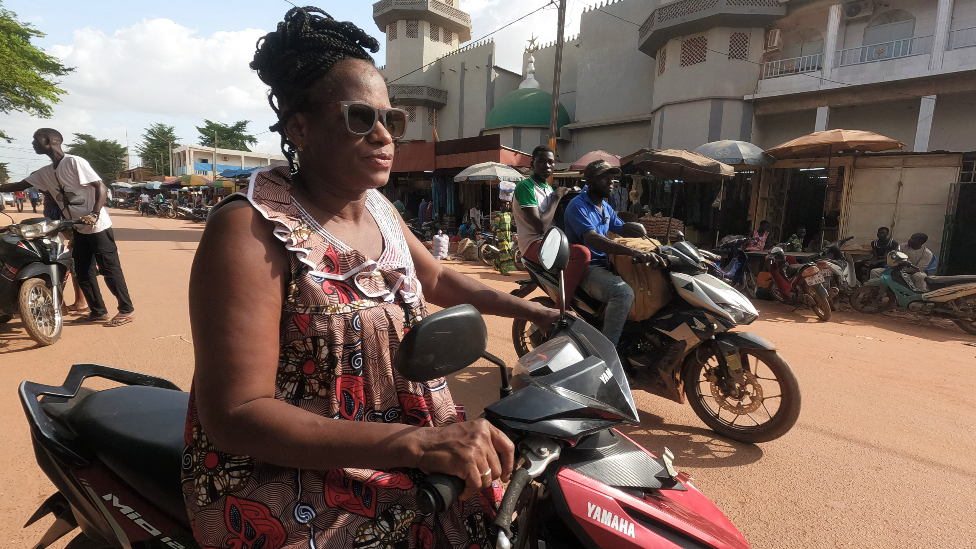 A woman on a motorbike in Ouagadougou, Burkina Faso - Tuesday 12 July 2022