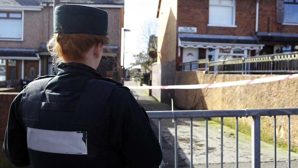 A police officer at the scene of Michael McGibbon's murder