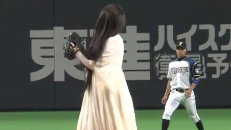 Sadako pitching a ball