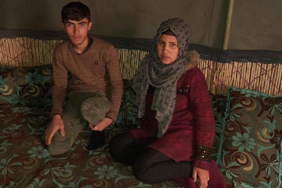 Dima and her husband Abdul Majid stand in their earthquake-destroyed home in Jindayris, Syria