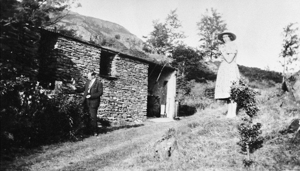 Kurt Schwitters outside the Merz Barn with Hilde Goldschmidt, 1946/47