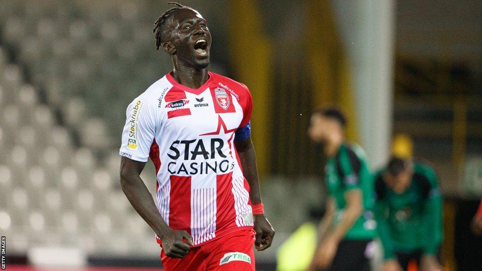 Mbaye Leye celebrates a goal for Belgian club Royal Excel Mouscron in 2019