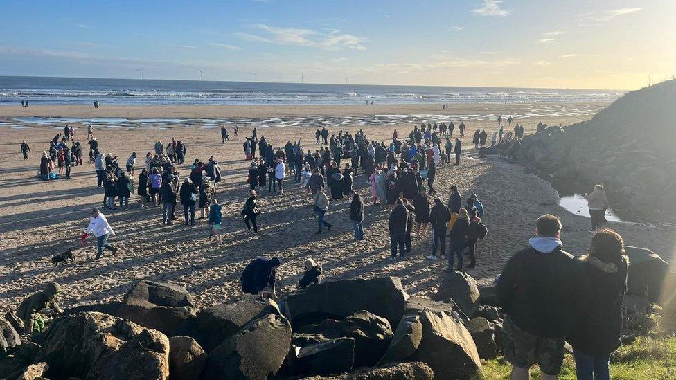 Hundreds of people on the beach at Cambois