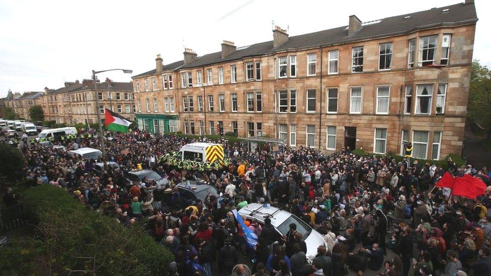 Police and protesters surround an immigration van in Kenmure Street, Glasgow 13 May 2021