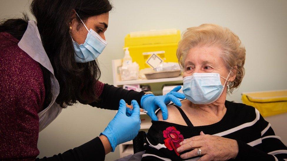 A vaccination being administered in a branch of Boots in Halifax