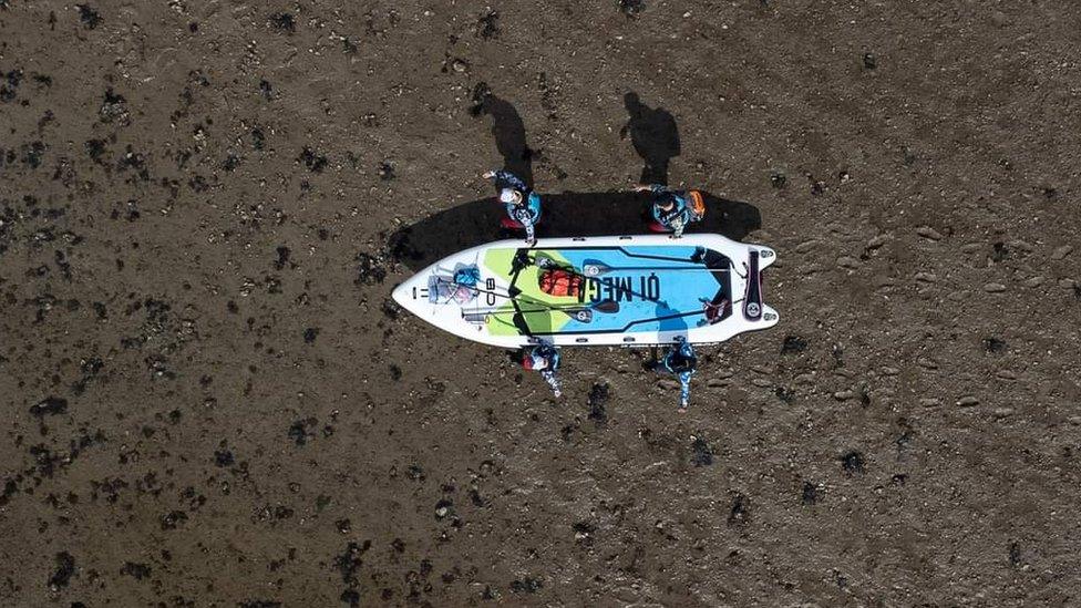 Oli Jordan, Andy Large, Jess Ashley and Matt Payne on the paddleboard