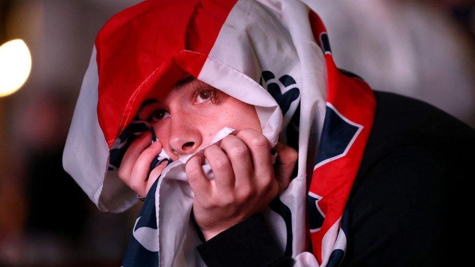 Person with England flag on head