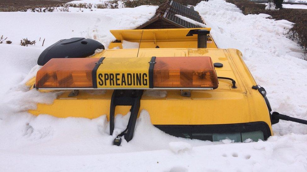 A gritter is buried in snow in Sully, Vale of Glamorgan