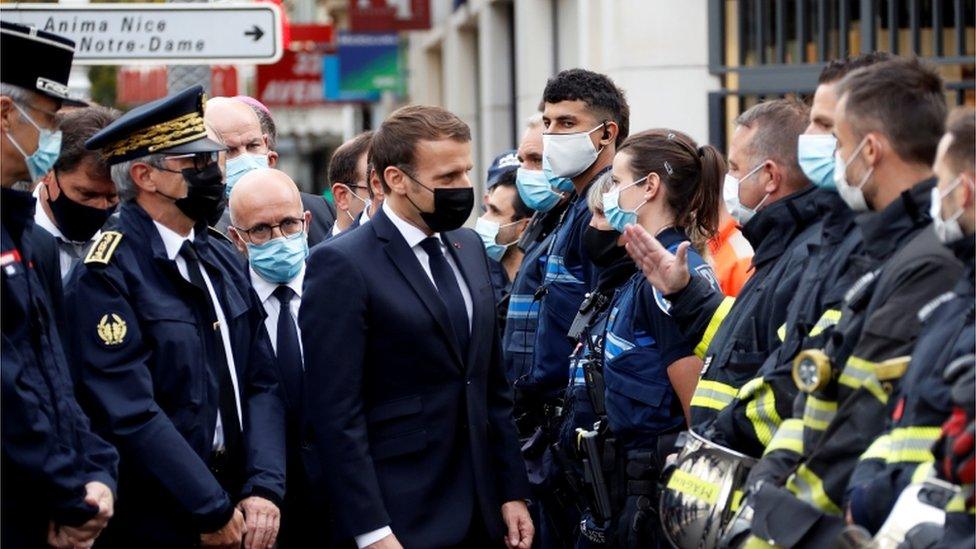 President Emmanuel Macron visits the scene of a knife attack at Notre Dame church in Nice, France