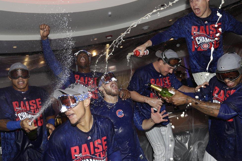 The Chicago Cubs celebrate in Chicago, 22 October