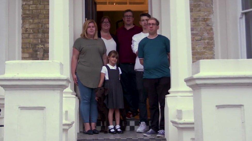 The family outside their home