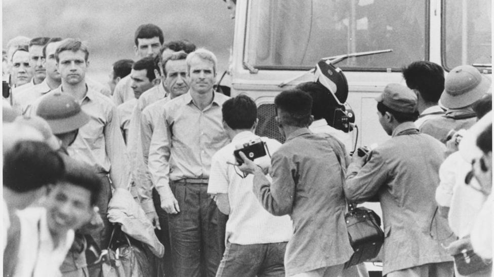 McCain waiting for the rest of the group to leave the bus at airport after being released as POW Record Group 428 General Records of the Department of the Navy, 1947-2004 Citation: 428-GX Box 262 N 11556665 Rediscovery #10473 10473 2007 001 John McCain After Being Released as Prisoner of War