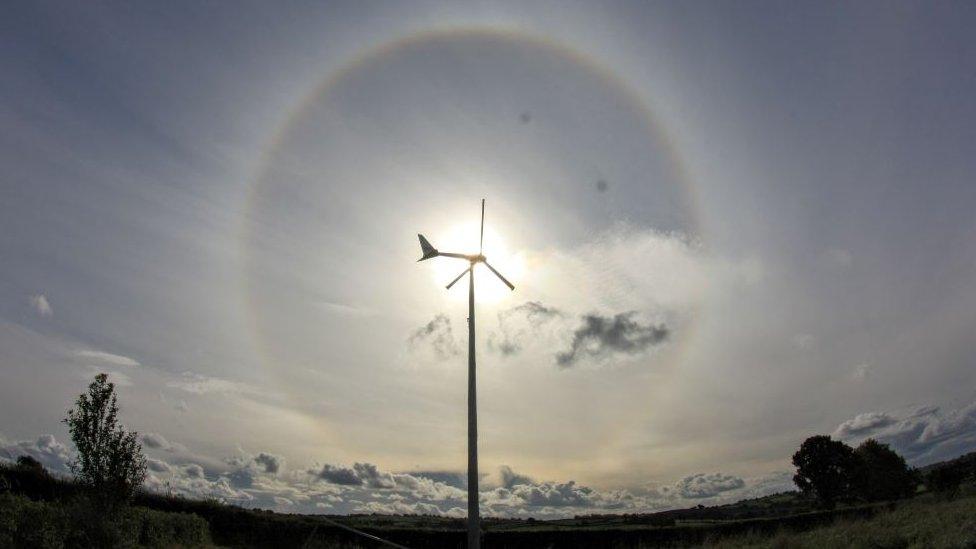 22 degree halo with the sun positioned behind a wind turbine taken in Banbridge