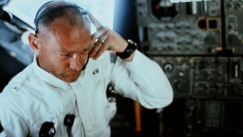 Image shows Buzz Aldrin wearing space suit