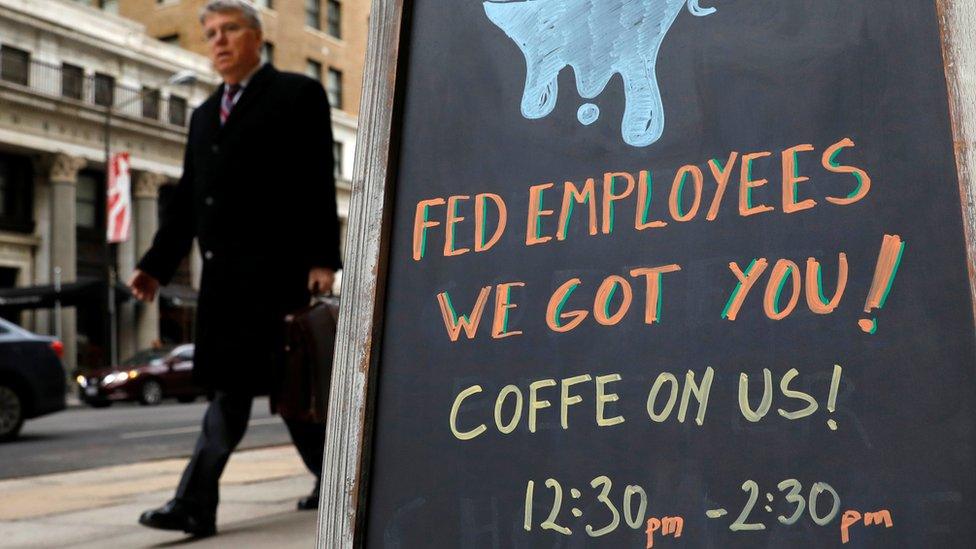 Sign reads: "Fed employees we got you -- coffee on us"