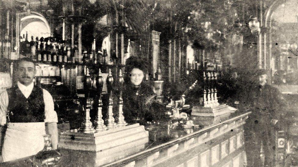 Black and white photo of bar staff at an unnamed pub in Middlesbrough